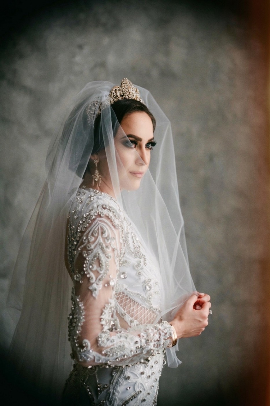 A bridal portrait in the Holga look: soft dreamy center, the corners darkening and collapsing into a heavy vignette, warm forgiving Portra skin.