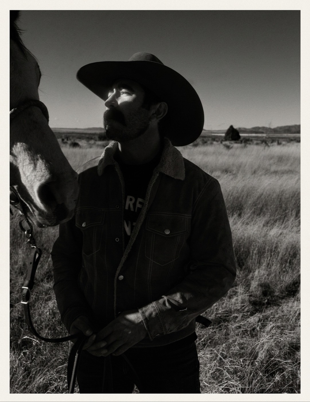 Black and white in open country. Hard sun, full tonal range, nothing crushed.