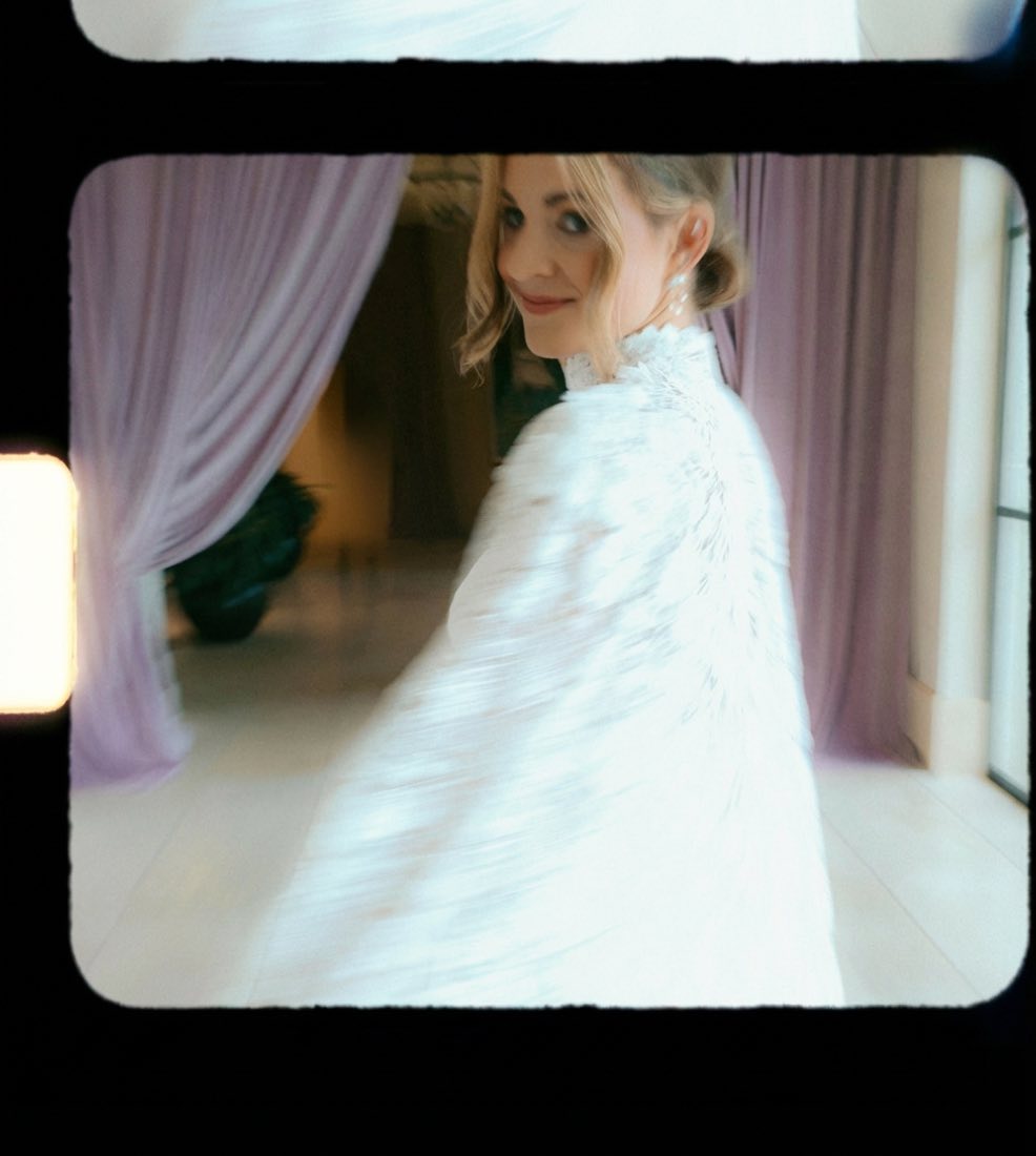 Bride behind curtain, film tones